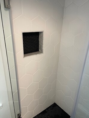 Shower, hair dryer, towels, shampoo