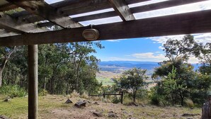 A covered outdoor area with a view of a hilly landscape. - The gallery - eco-friendly atmosphere (Vacy)