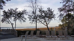 A pool area with lounge chairs and a view of the beach. - July 4th Week MARRIOTT'S HARBOUR CLUB AT HARBOUR TOWN excellent location in town (Hilton Head Island)