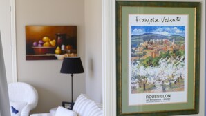 A framed artwork of a cityscape labeled "Francoise Valenti" and "ROUSSILLON en Provence - 84220".