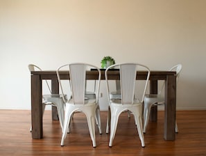 Enjoy meals in this dining area with a wooden table and four chairs.