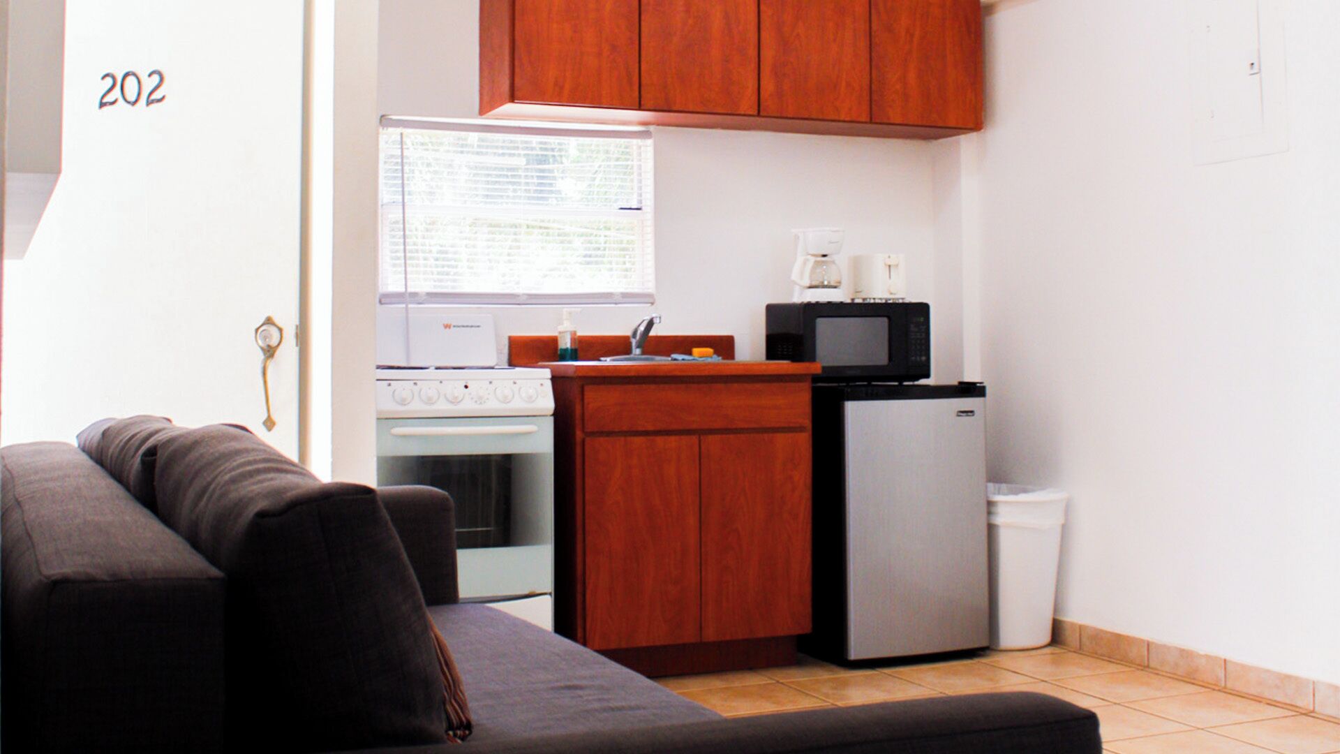 Fridge, microwave, stovetop, coffee/tea maker