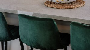 A kitchen counter with a fruit basket, green velvet chairs, and a stainless steel refrigerator. - How To Live Better In Split, Apartment  (Split)