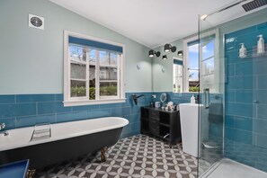 Bathtub, hair dryer, towels, soap