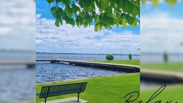 A bench by a calm water body with a bridge in the background. - Hyland Hideaway Yarrawonga (Yarrawonga)