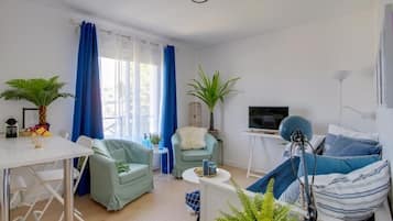 Deluxe Apartment, 1 King Bed with Sofa bed, Non Smoking | Living area | Flat-screen TV