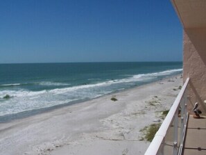 A beach view from a balcony with a clear sky. - Beachcomber unit 608 (Longboat Key)