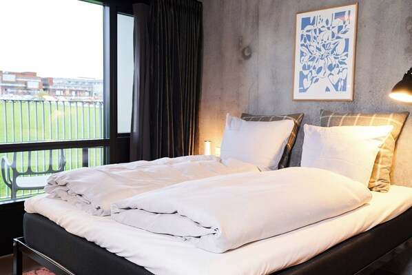 Hypo-allergenic bedding, down duvets, in-room safe