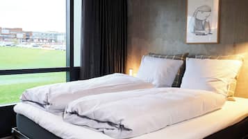 Hypo-allergenic bedding, down duvets, in-room safe