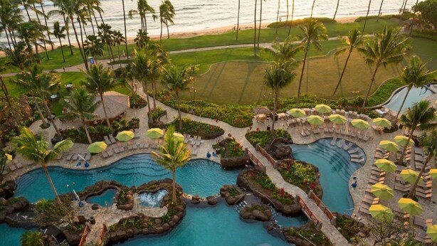 A resort with multiple swimming pools, palm trees, and a view of the beach. - PRICES REDUCED! HYATT RES. CLUB-OCEAN FRONT, MAUI MAY 23-30, & MAY 30-JUNE 6. (Lahaina)