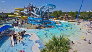A water park with multiple slides and pools, including a large central water slide and several smaller slides. - Newly renovated- Panoramic Ocean Views Seconds to the Beach - Sandy Feet Retreat (Freeport)
