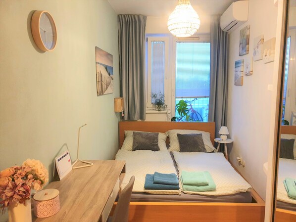 1 bedroom, desk, iron/ironing board, travel crib