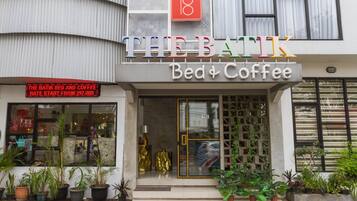 A building with a sign reading "THE BAK" and "Bed & Coffee".