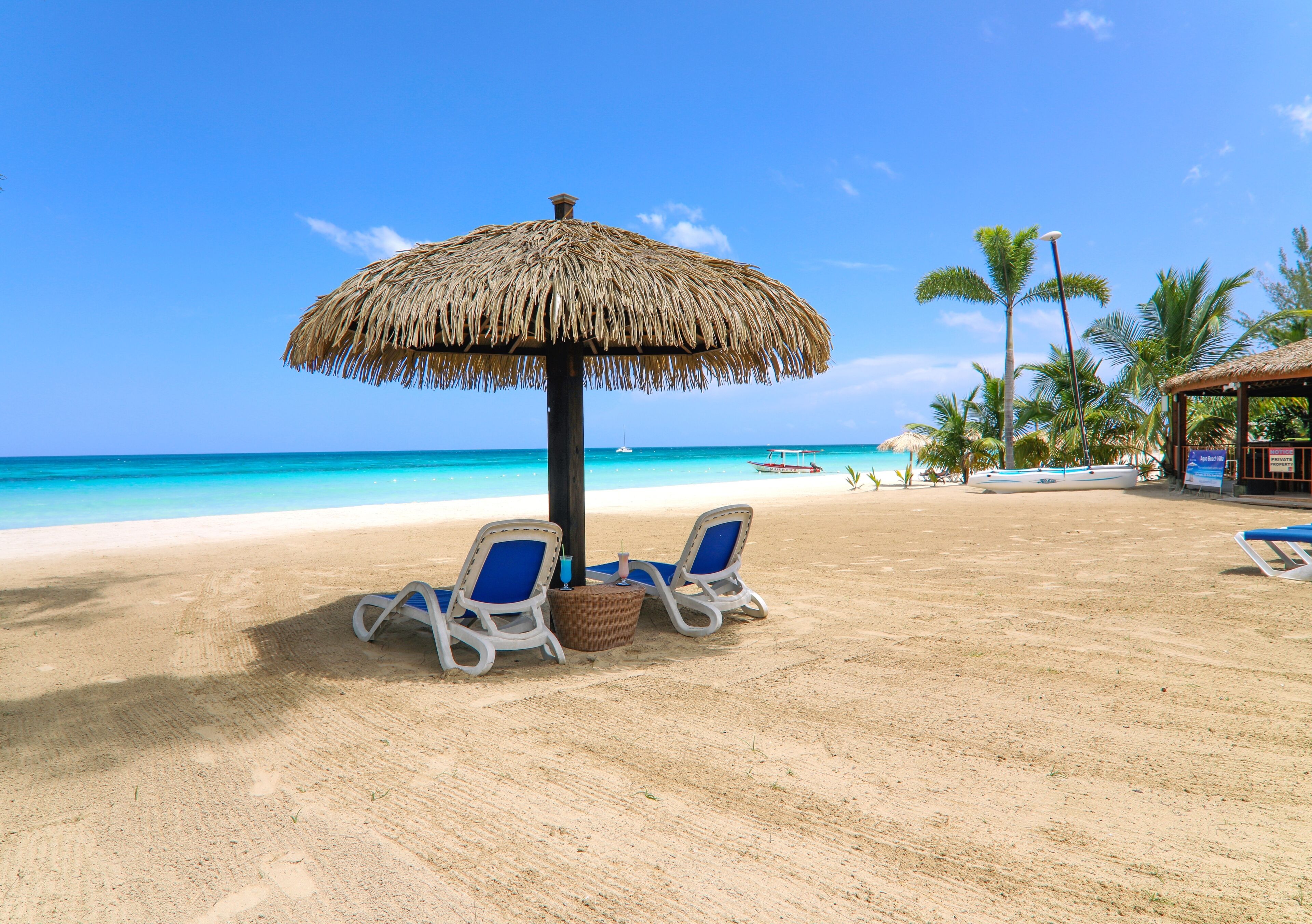 On the beach, sun loungers, beach towels