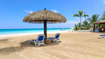 On the beach, sun loungers, beach towels