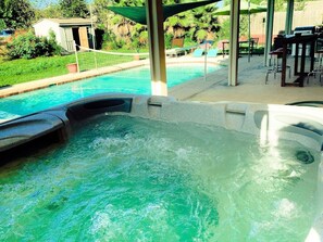 Outdoor spa tub - Spacious 7BR Getaway with Pool, Hot Tub & Arcades (Pflugerville)