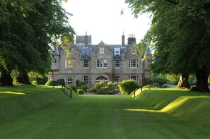 A large, historic stone building with a symmetrical facade, large windows, and a central entrance. - Historic 2000 Acre Country Estate in Rural Ayrshire, near Troon and Prestwick. (Hurlford)