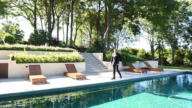 A swimming pool with lounge chairs, a staircase, and a well-maintained garden. - Byron Hinterland Retreat - Honeymoon (Repentance Creek)