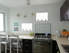 Fridge, microwave, stovetop, coffee/tea maker