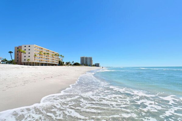 On the beach, sun-loungers, beach towels