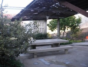Situated in a serene outdoor setting, this bench offers a peaceful spot to rest.