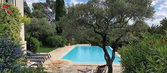 Villa with outdoor kitchen with pizza oven and large heated pool.
