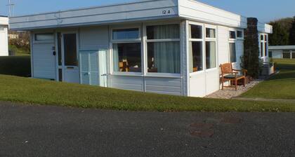 Chalet Cwtch, a cosy 5 bed holiday cottage in Roch, Pembrokeshire