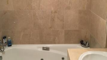 Bathtub, hair dryer, bidet, towels