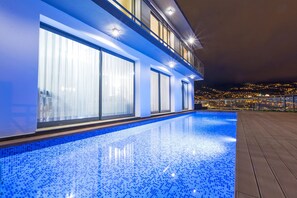 Relax by the pool surrounded by a spacious deck and take in the views from the adjacent balcony.