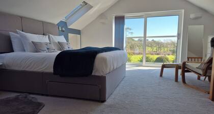 A luxurious spacious home, village location. 5 mins to the beach, EV Charger.