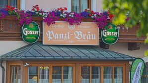 A building with a sign that reads "Panzl-Brau" and "Gösser" beer logos. - Panzl braü (Virgen)