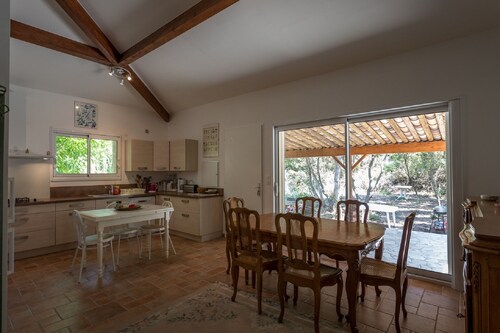 house located in a haven of greenery 15 minutes walk from the beach of Maora