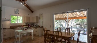 house located in a haven of greenery 15 minutes walk from the beach of Maora