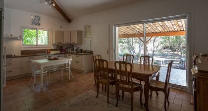 house located in a haven of greenery 15 minutes walk from the beach of Maora