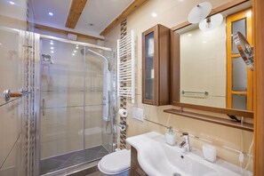 Shower, rainfall showerhead, hair dryer, towels