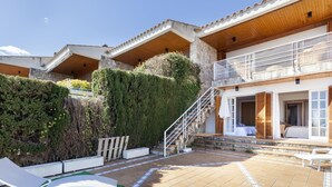 A villa with a patio, a staircase, and a pool area. - SAILOR HOUSE with SEA VIEWS (Tossa de Mar)