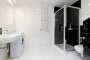 Shower, hair dryer, towels, shampoo