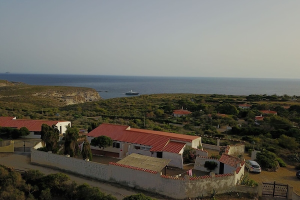 Villa air view with the mediterranean sea in the background