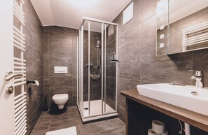 Bathtub, hair dryer, towels, soap