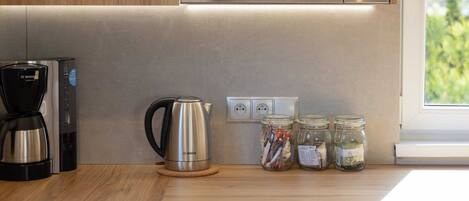 Coffee/tea maker, fridge, microwave, oven