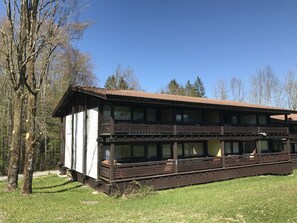 Situated in a serene natural setting, this traditional lodge offers a peaceful retreat with a balcony and multiple rooms.