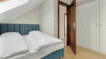 The bedroom with a spacious wardrobe makes longer stays easier, offering practical storage space.