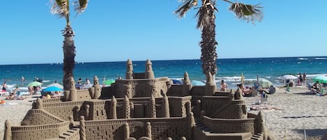 On the beach, sun-loungers