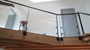 A wooden staircase with a glass railing leading to a loft area. - Duplex "La Ferme de Paul" 6 Pers. + baby - Altitude 800 m'at 2 km Ski slopes (La Bresse)