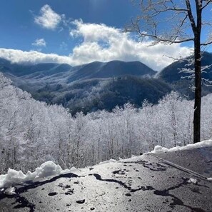 A snowy mountain landscape with a clear sky.