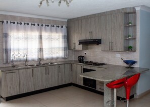Fridge, microwave, oven, stovetop - Fully furnished and secure four bedroomed home (Harare)