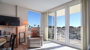 A spacious balcony with a clear view of the cityscape.