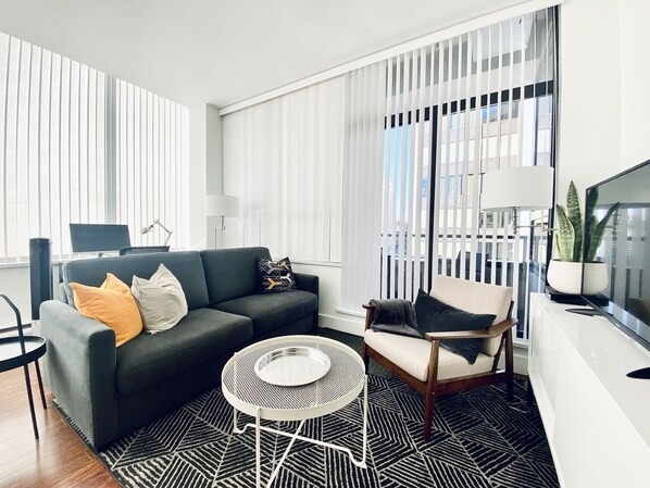 Smart TV, DVD player, computer monitors - The Charlie Suite by COMFYSUITES (Vancouver)