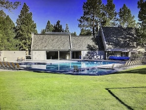 Relax by the pool surrounded by lush greenery and lounge in comfort.