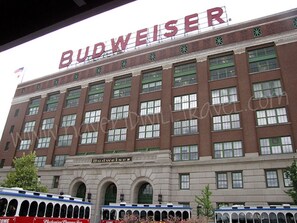 A large, multi-story building with the name 'Budweiser' prominently displayed on the facade. - Pretty *3BDR/2Bath Home* in a Good Area Next to Parks & Close to Downtown! (St. Louis)